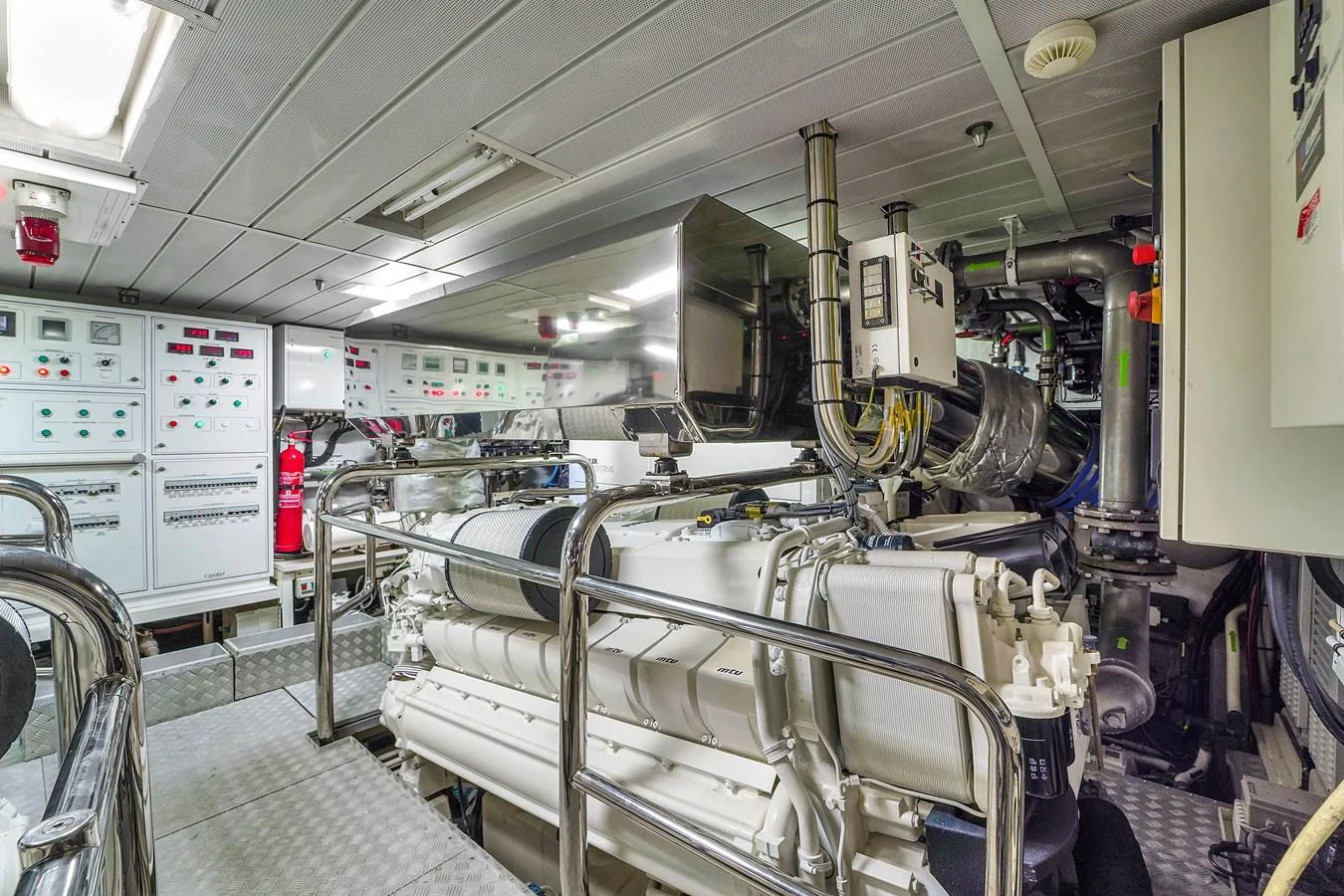 The engine room showcases advanced machinery and control panels, highlighting the yacht's technical sophistication. aboard AZIMUT GRANDE 105 Yacht for Sale