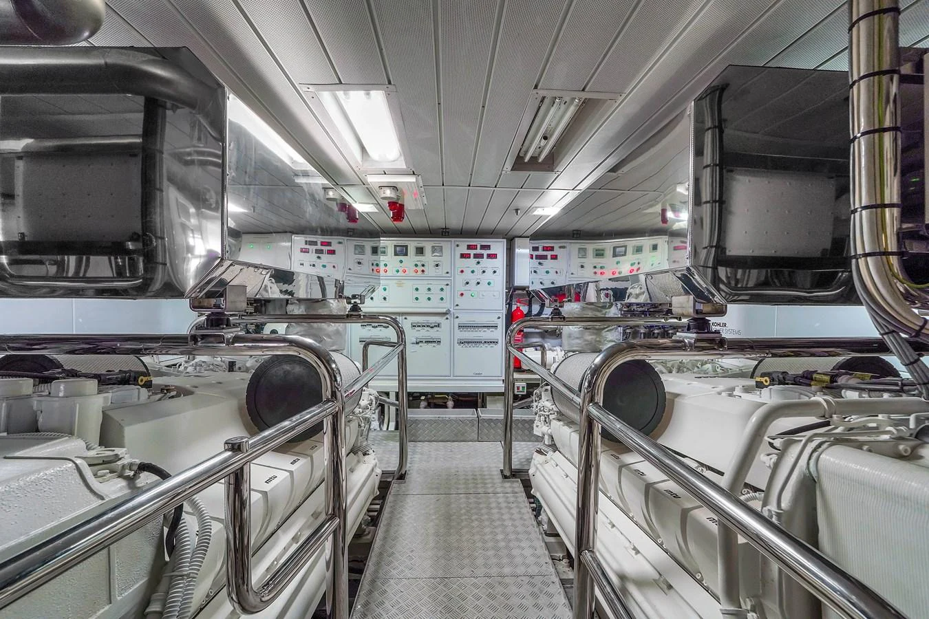 The image showcases the yacht's well-maintained engine room with advanced machinery and control panels. aboard AZIMUT GRANDE 105 Yacht for Sale