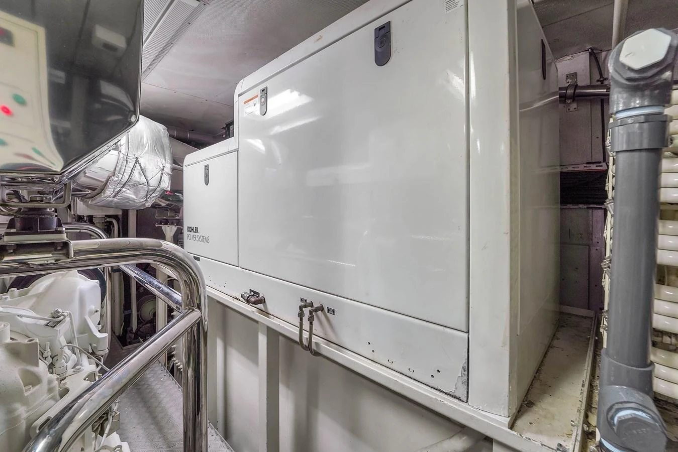 The image showcases the yacht's engine room with a focus on the machinery and equipment. aboard AZIMUT GRANDE 105 Yacht for Sale