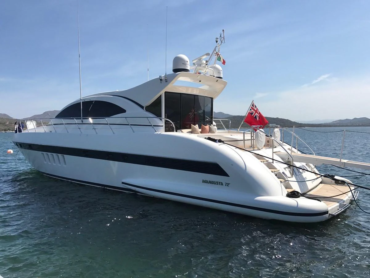 A sleek and modern yacht is anchored on calm waters, showcasing its elegant design and spacious aft deck. aboard SEVEN ZERO Yacht for Sale