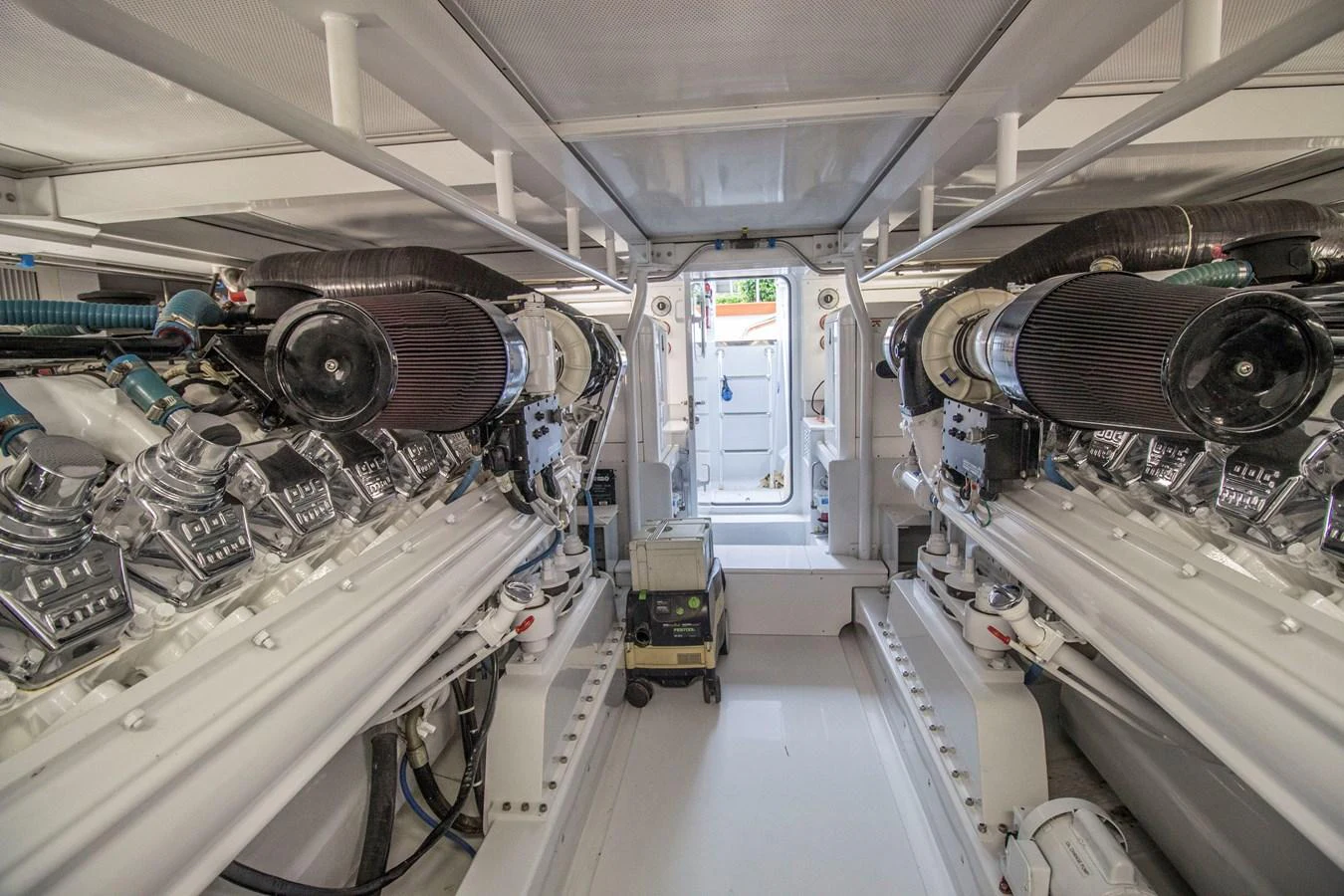 The image showcases the meticulously organized engine room of the yacht, highlighting its powerful machinery. aboard REMAIN CALM Yacht for Sale
