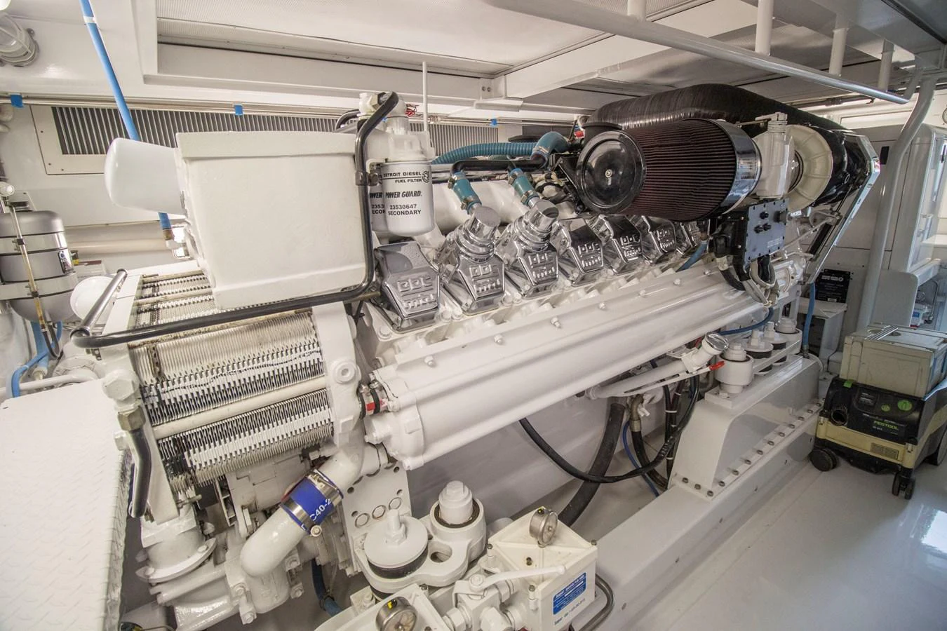 The image showcases the pristine engine room with a powerful, well-maintained engine. aboard REMAIN CALM Yacht for Sale