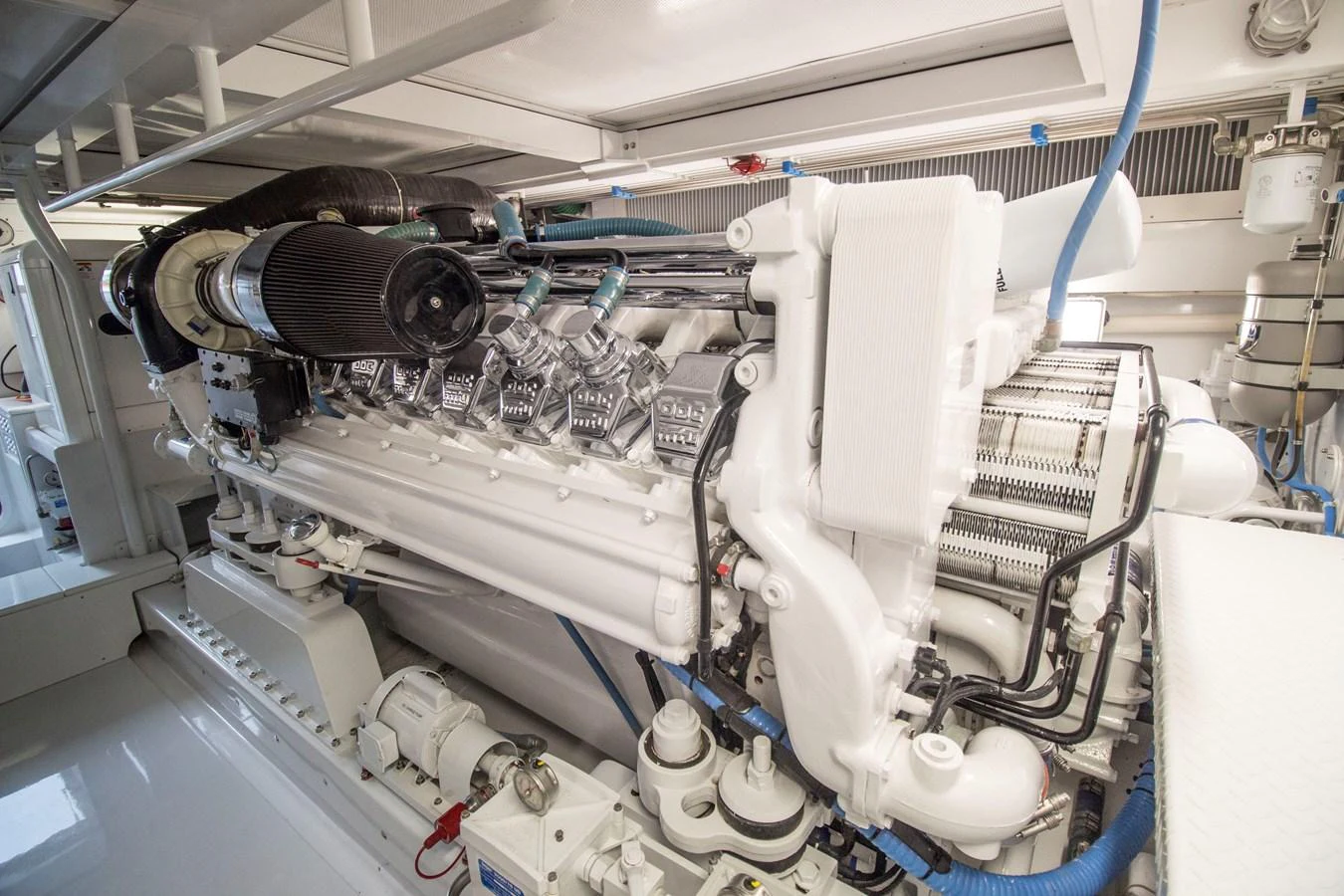 The image showcases the pristine engine room with a powerful, well-maintained engine. aboard REMAIN CALM Yacht for Sale