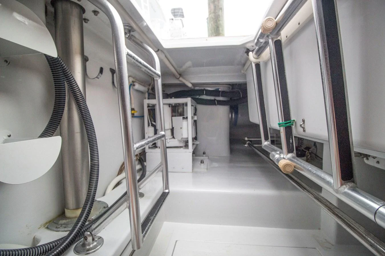 A detailed view of the yacht's mechanical or storage area, showcasing its clean and organized layout. aboard REMAIN CALM Yacht for Sale