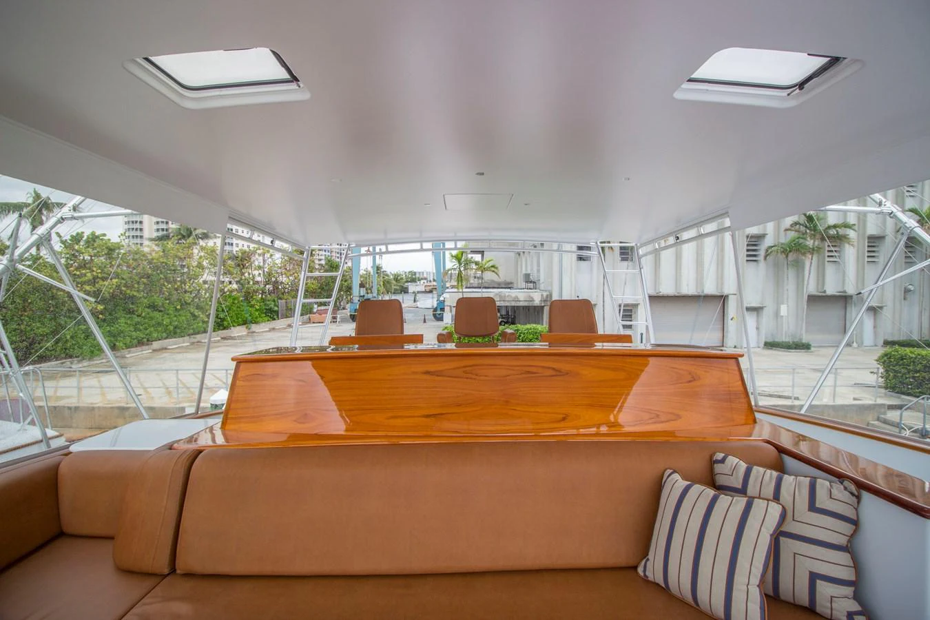 The flybridge offers a comfortable seating area with a view of the surroundings. aboard REMAIN CALM Yacht for Sale