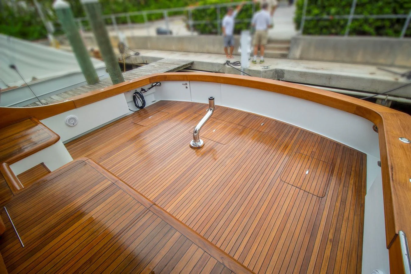 The aft deck features beautifully finished wooden flooring and clean lines, perfect for relaxation and entertaining. aboard REMAIN CALM Yacht for Sale
