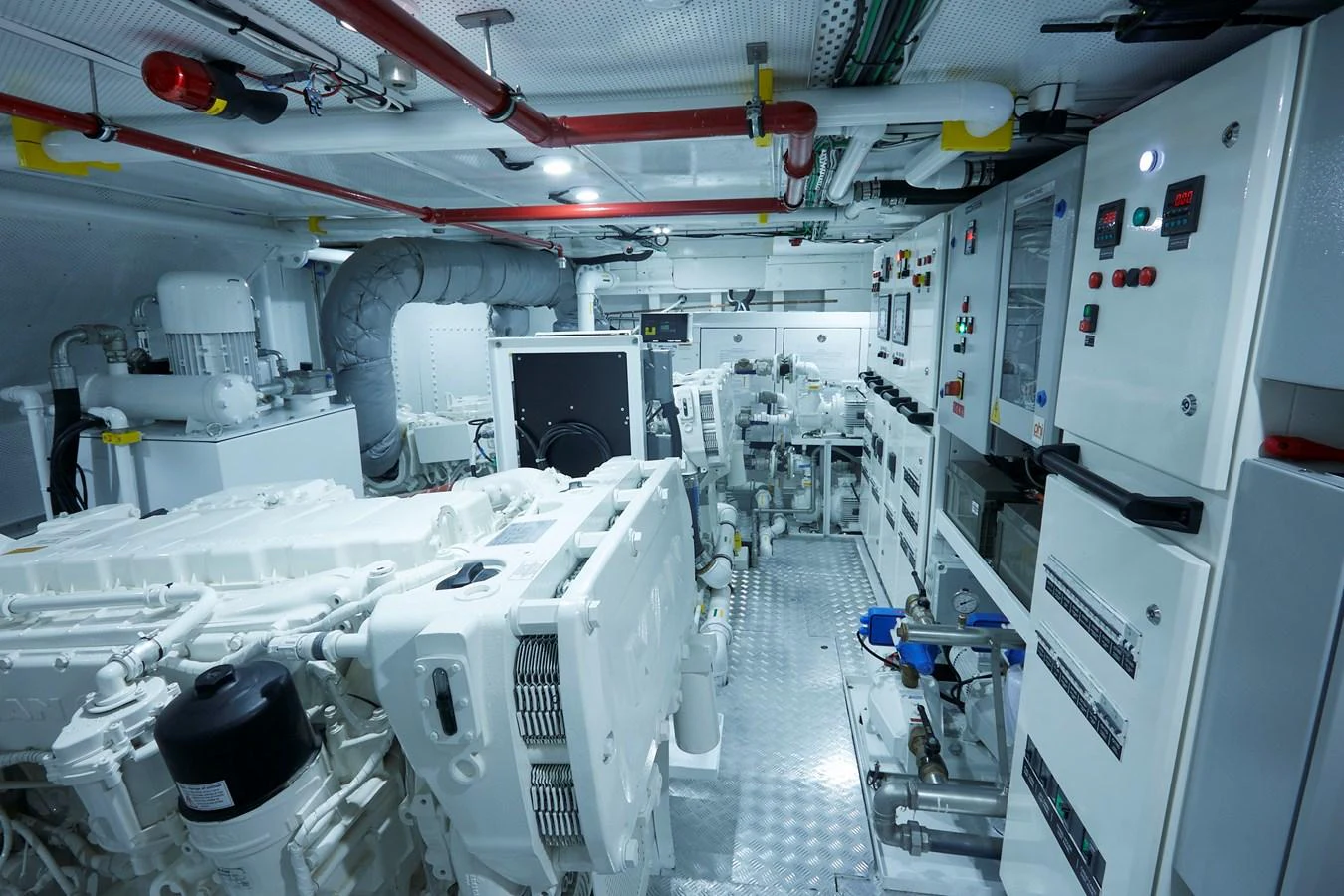 The image showcases a well-organized and clean engine room with advanced machinery and control panels. aboard WHITE WINGS Yacht for Sale