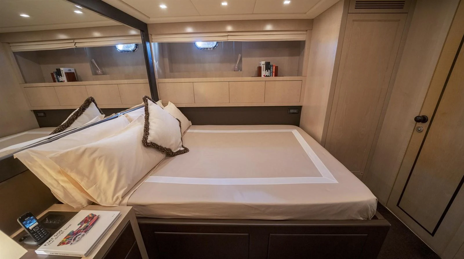 a bed with a white sheet aboard MANU Yacht for Sale