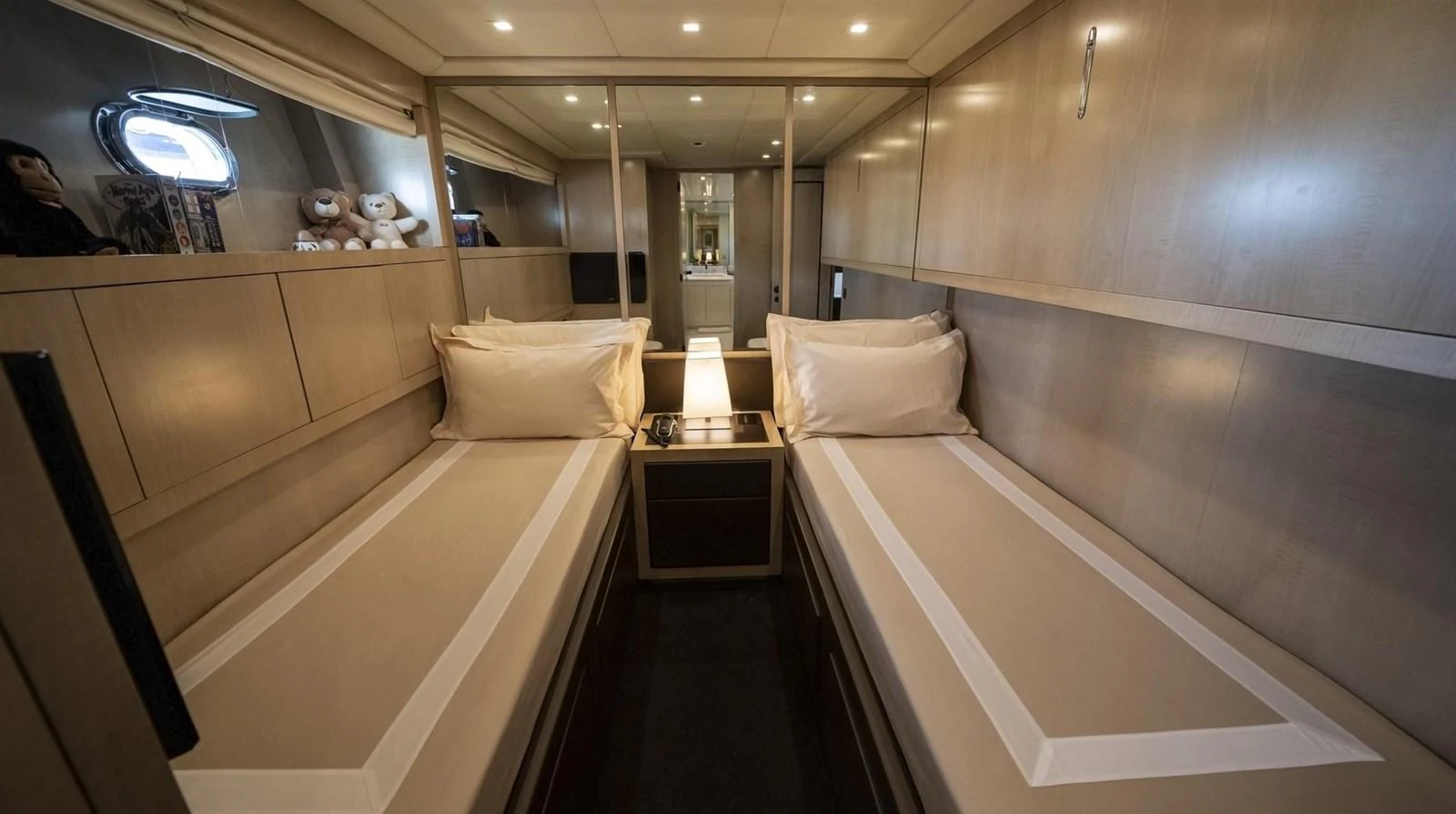 a room with a bed and a table aboard MANU Yacht for Sale