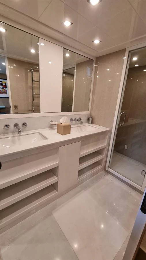 a bathroom with a large mirror aboard MANU Yacht for Sale