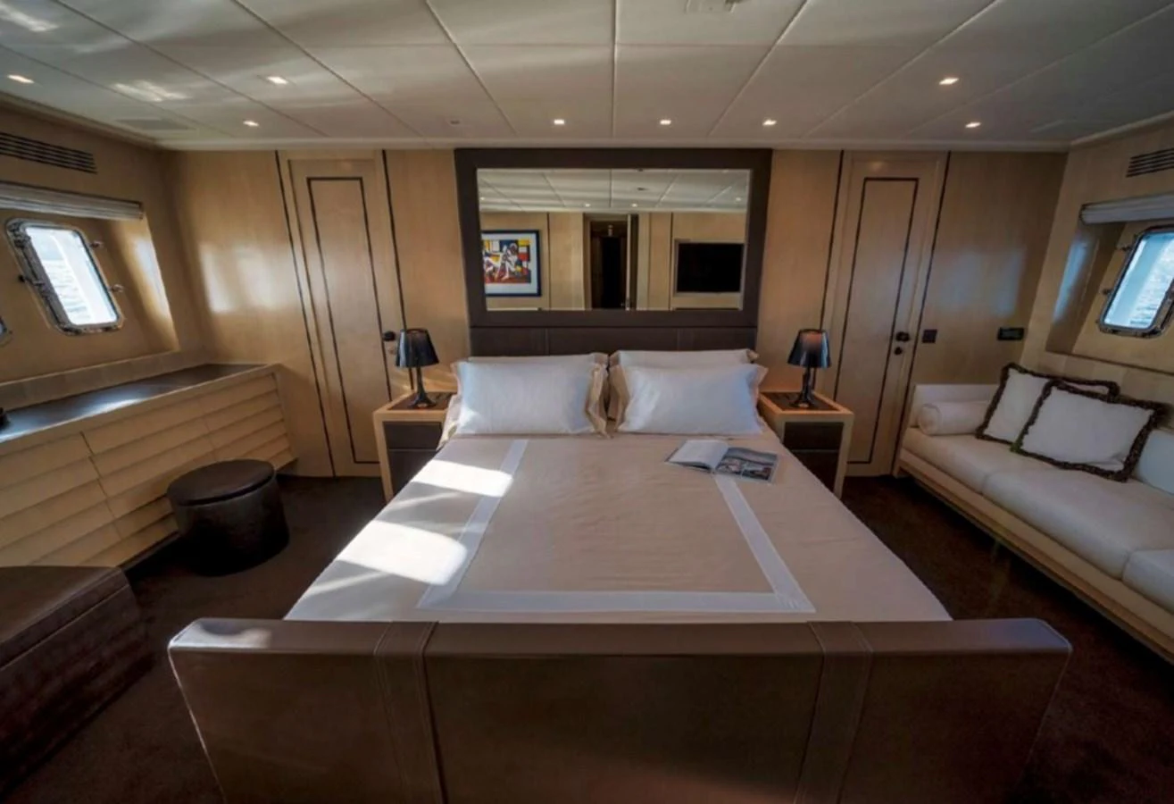 a large bed in a room aboard MANU Yacht for Sale