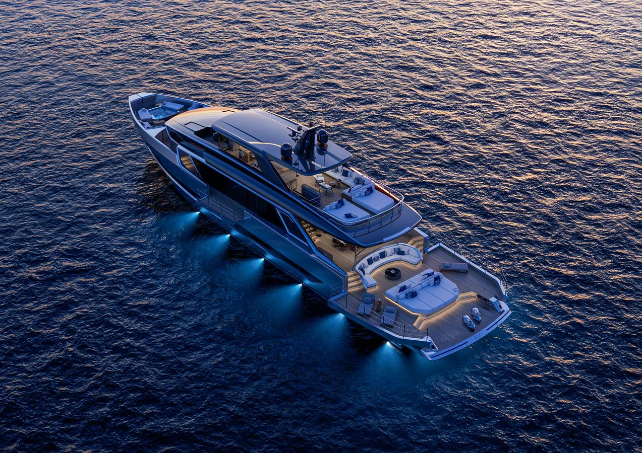 A luxurious yacht illuminated by underwater lights, cruising on calm waters at dusk. aboard ISA VIPER 130 Yacht for Sale