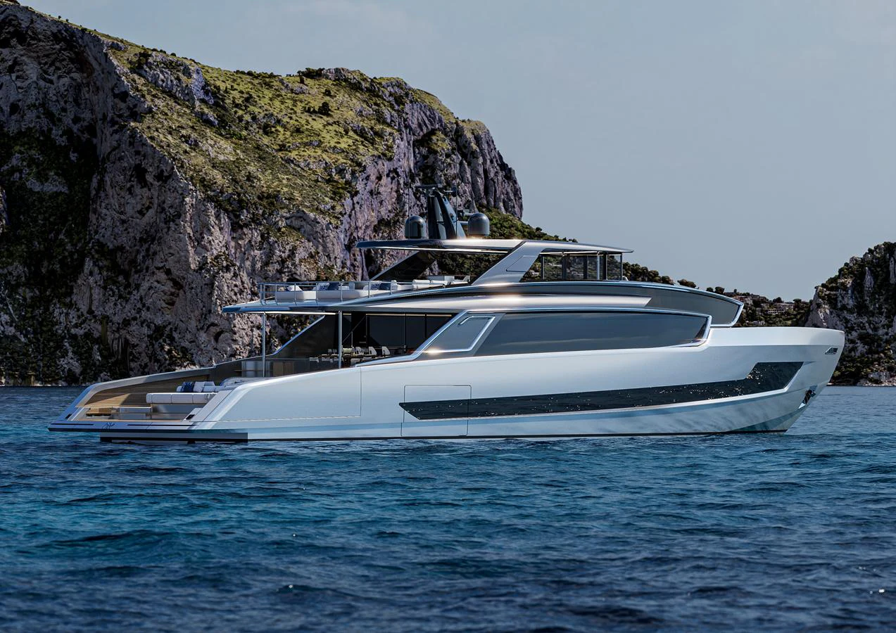 A sleek and modern yacht cruises gracefully near rocky cliffs, showcasing its elegant design. aboard ISA VIPER 130 Yacht for Sale