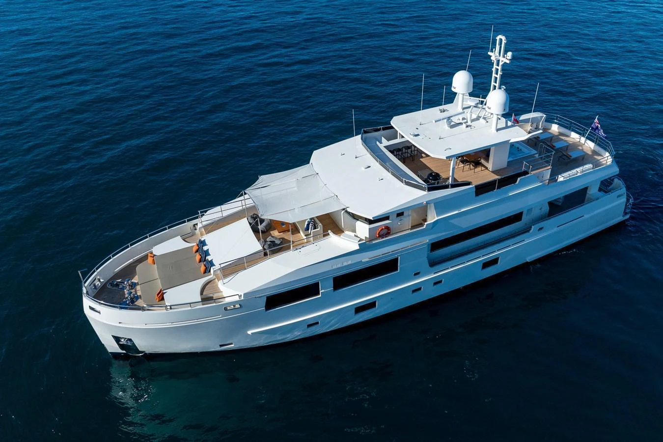 A sleek and modern yacht cruising on calm blue waters. aboard NYLA Yacht for Sale