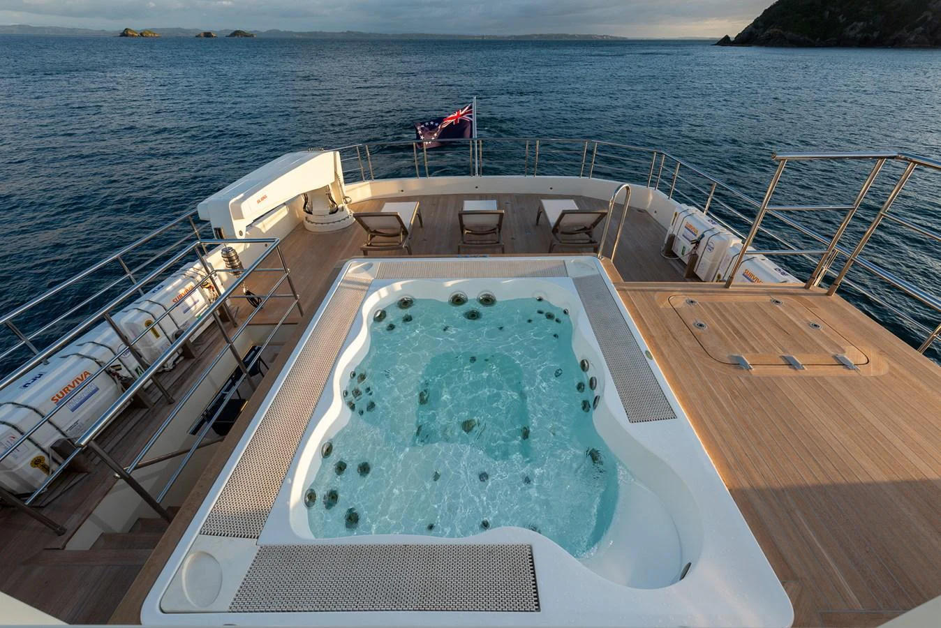 The aft deck features a luxurious jacuzzi with a stunning ocean view. aboard NYLA Yacht for Sale