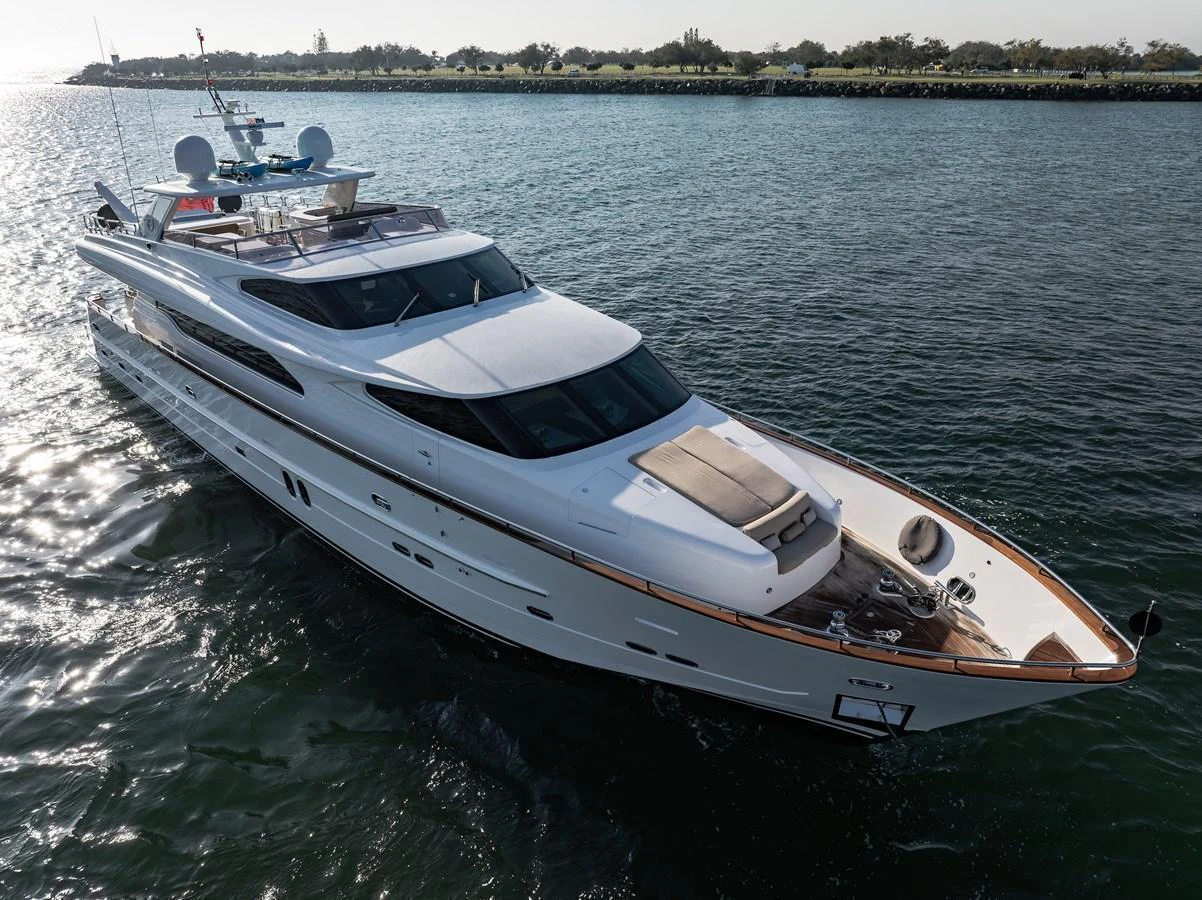 A sleek and modern yacht glides gracefully on the water, showcasing its elegant design and luxurious features. aboard THE CLUBHOUSE Yacht for Sale