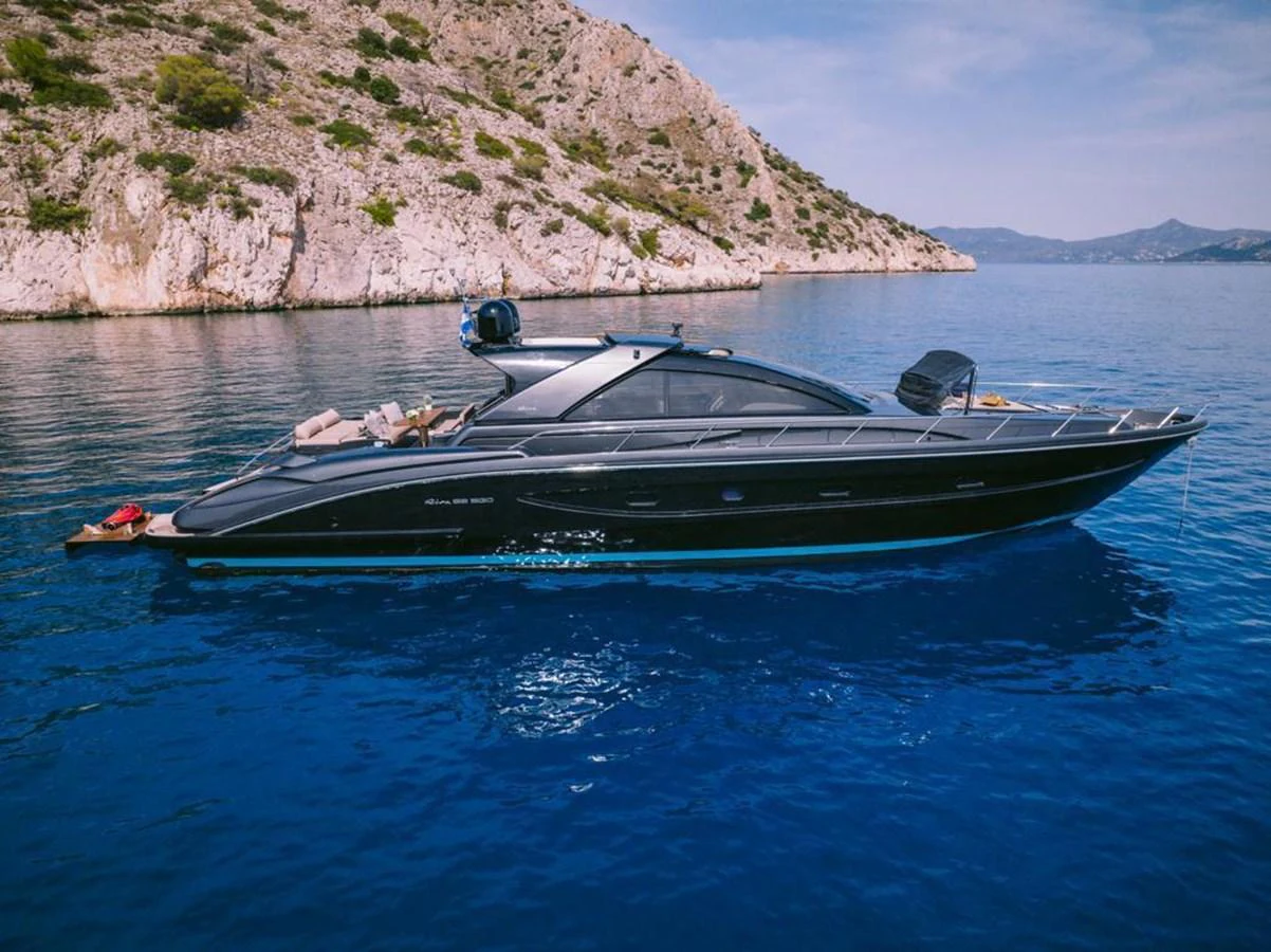 a person lying on a boat in the water aboard WHO CARES Yacht for Sale