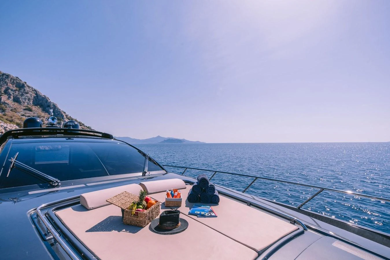 a boat with a basket of fruits on the front aboard WHO CARES Yacht for Sale