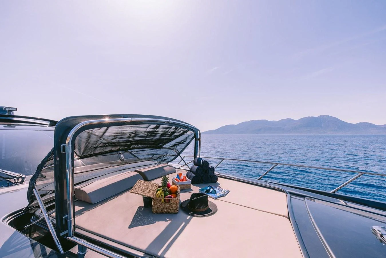 a boat with a basket of fruit on the front aboard WHO CARES Yacht for Sale