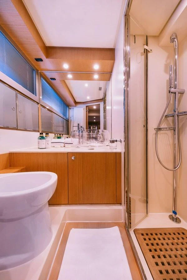 a bathroom with a shower and sink aboard WHO CARES Yacht for Sale