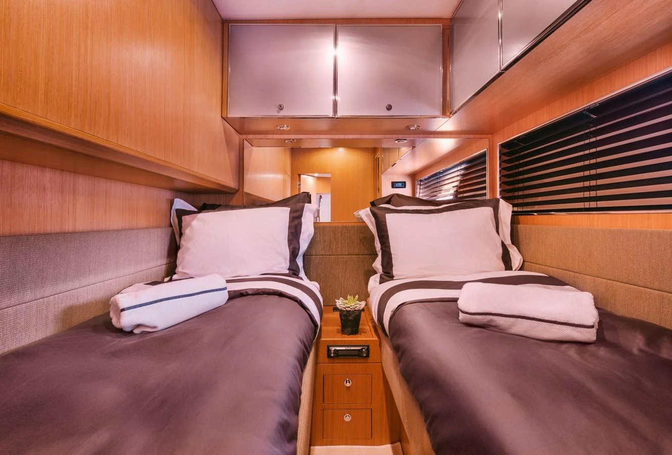 a room with two beds aboard WHO CARES Yacht for Sale