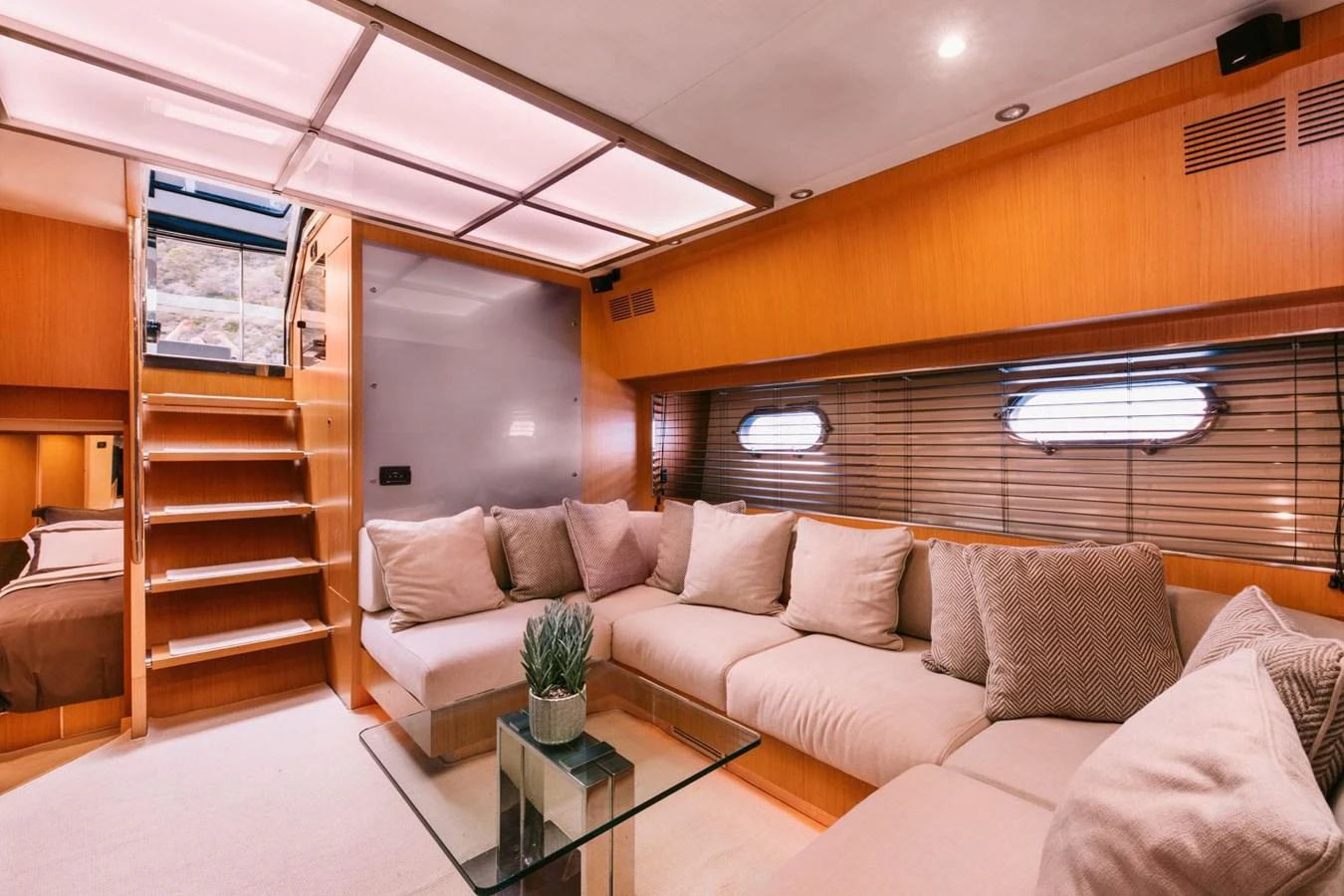 a living room with a couch and a coffee table aboard WHO CARES Yacht for Sale