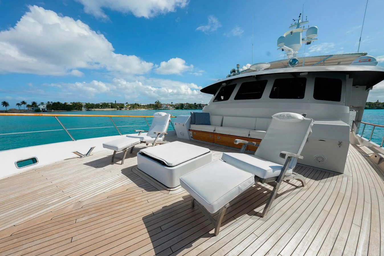 The sundeck offers a spacious area with comfortable lounge chairs and stunning views of the surrounding waters. aboard SERENITY Yacht for Sale