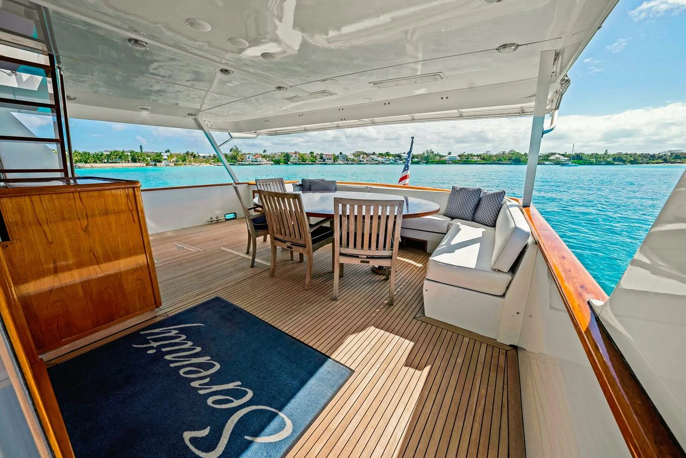 The aft deck offers a spacious and inviting area for alfresco dining and relaxation with stunning views of the water. aboard SERENITY Yacht for Sale