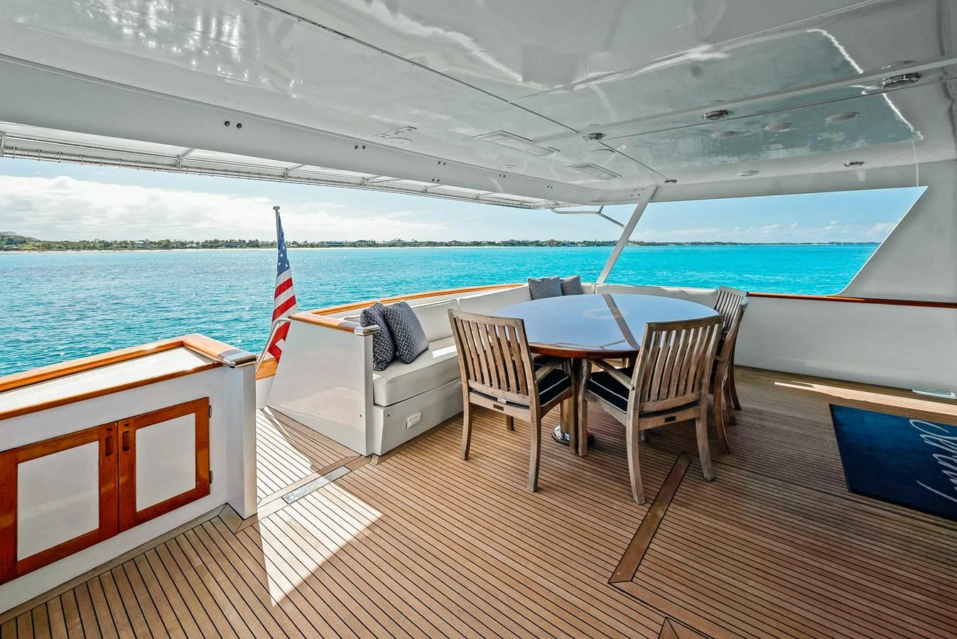 The aft deck offers a spacious and inviting area for alfresco dining with stunning ocean views. aboard SERENITY Yacht for Sale