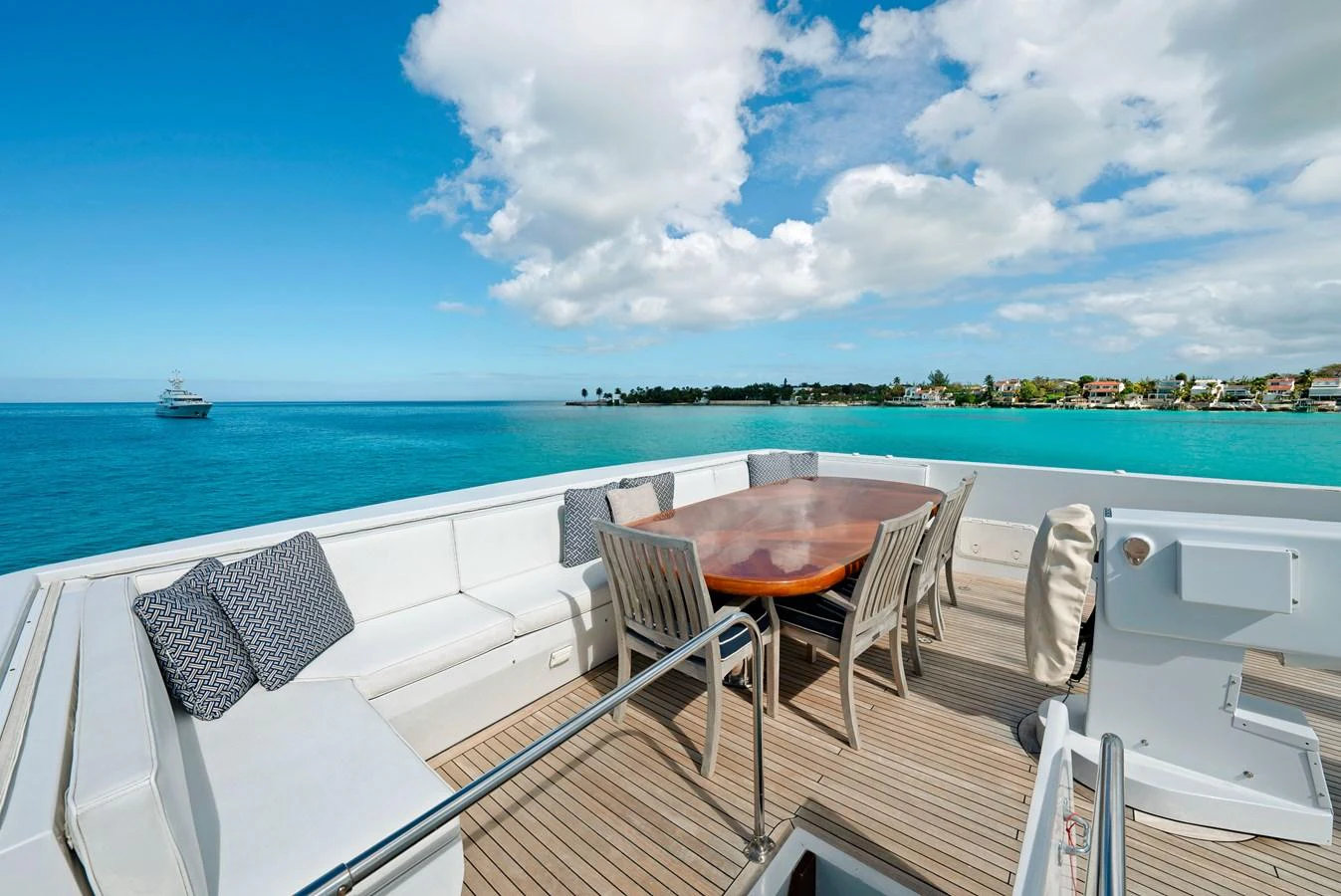 The aft deck offers a spacious and inviting area for alfresco dining with stunning ocean views. aboard SERENITY Yacht for Sale