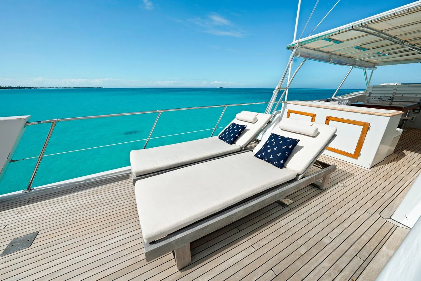 The sundeck offers luxurious lounging with stunning ocean views. aboard SERENITY Yacht for Sale
