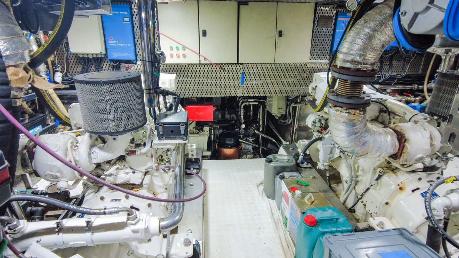 The image showcases the yacht's well-maintained engine room with visible machinery and equipment. aboard GOLDEN TOUCH Yacht for Sale