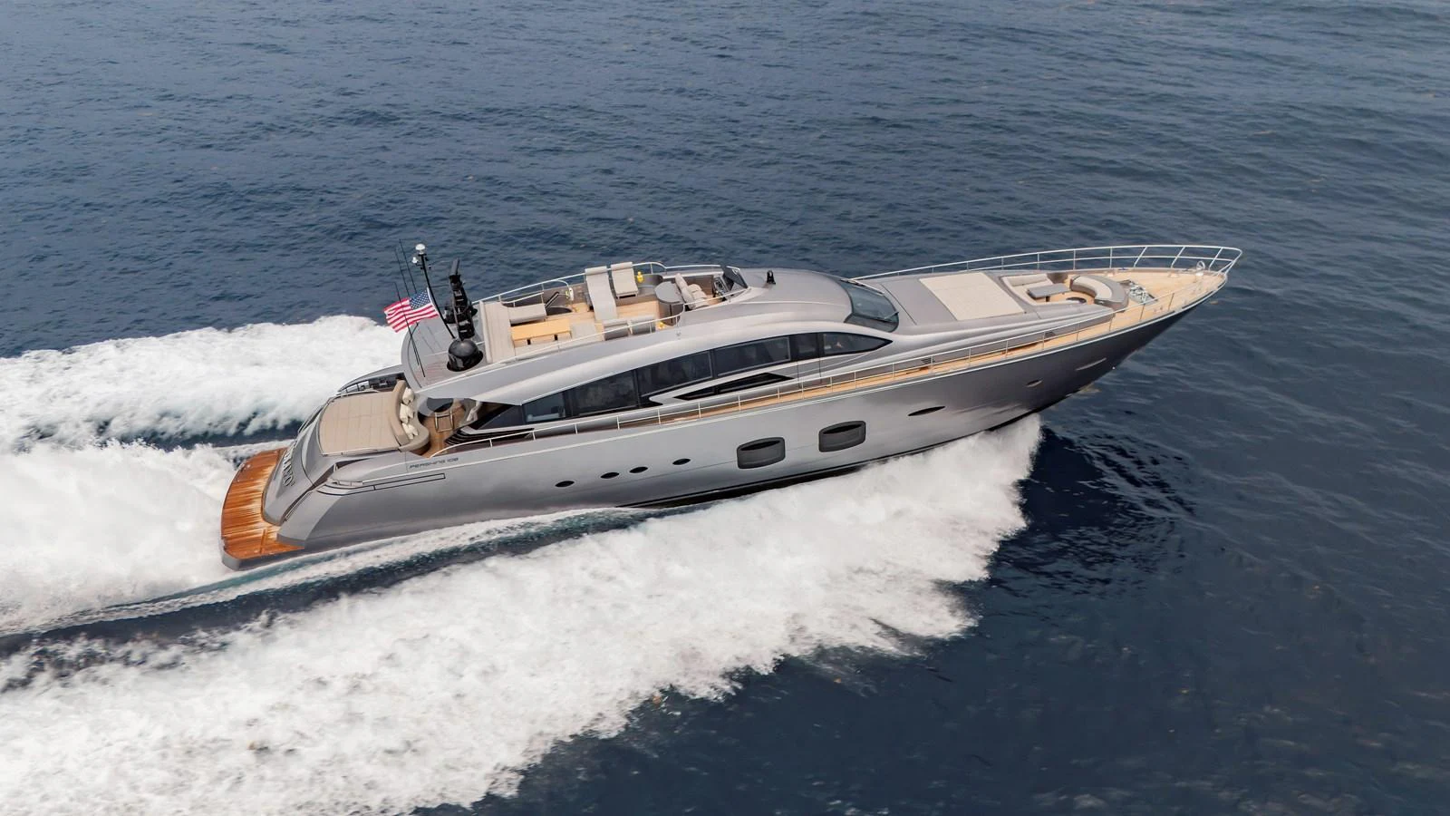 A sleek and modern yacht cruises swiftly through the open water, showcasing its elegant design and luxurious amenities. aboard ANDIAMO II Yacht for Sale