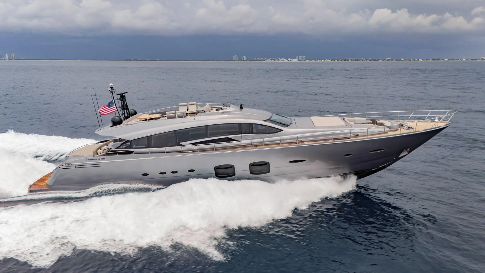 A sleek and modern yacht cruises swiftly through the open water, showcasing its elegant design and powerful performance. aboard ANDIAMO II Yacht for Sale