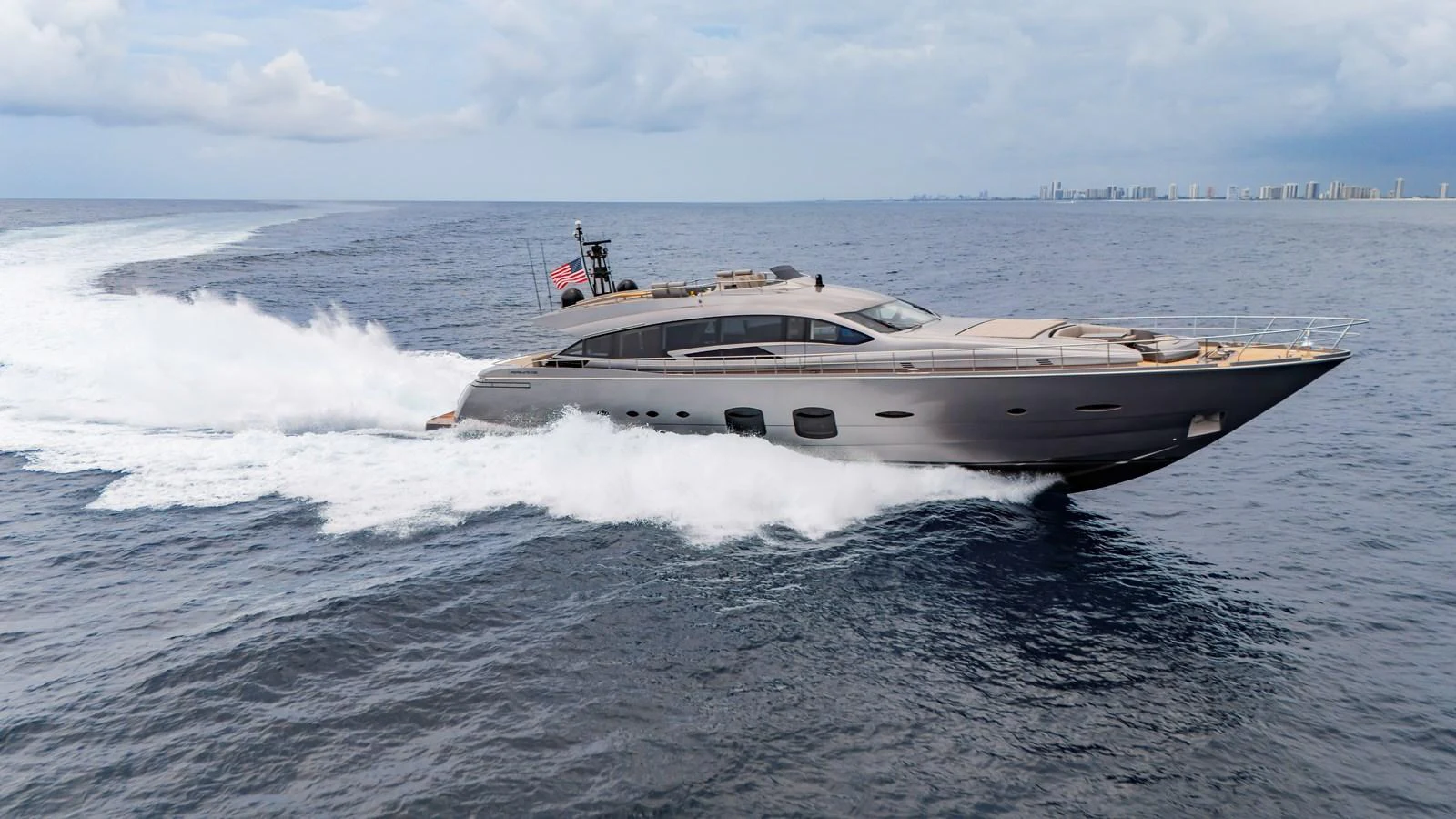 A sleek, modern yacht cruises swiftly through open waters, showcasing its elegant design and powerful performance. aboard ANDIAMO II Yacht for Sale