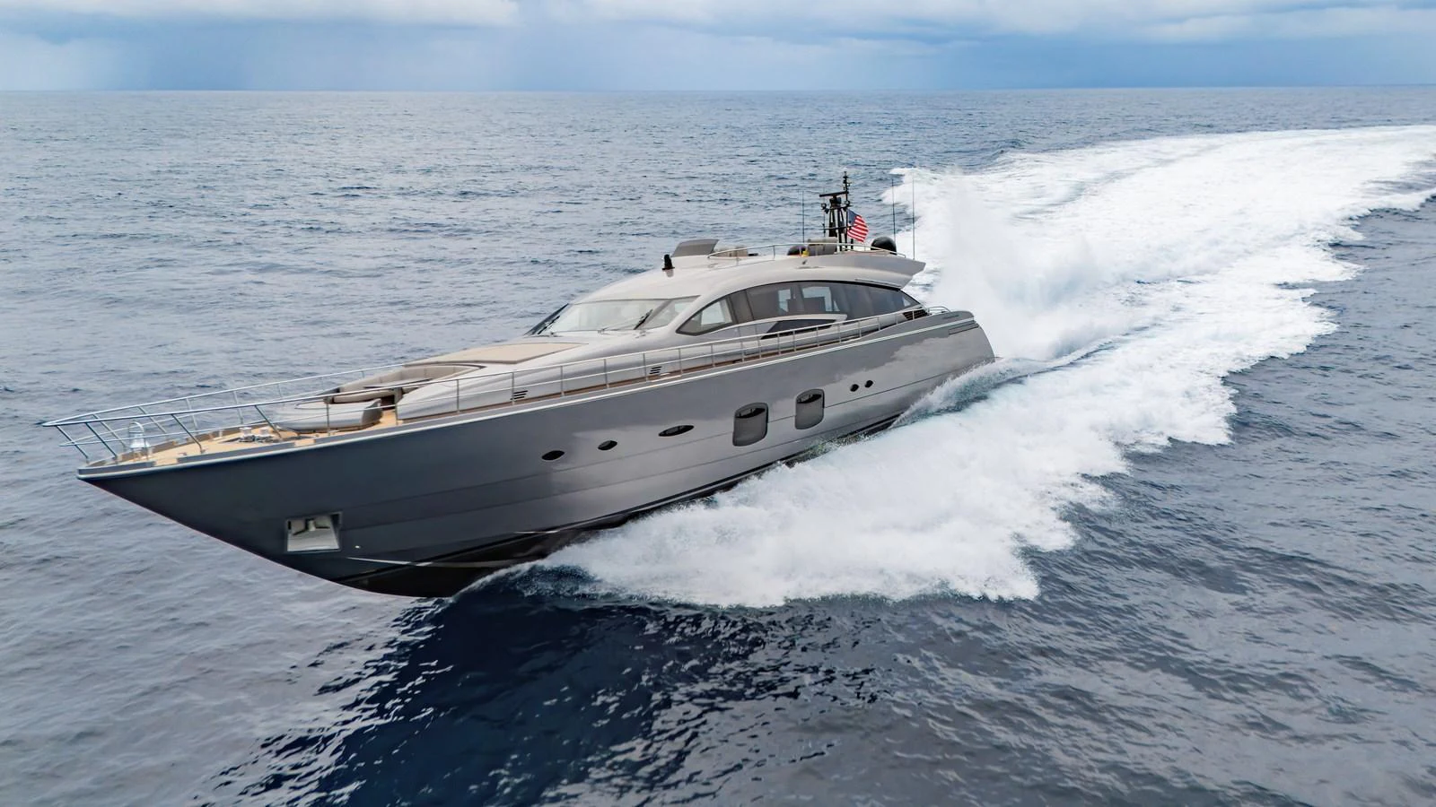 A sleek and modern yacht cruises swiftly through open waters, showcasing its elegant design and powerful performance. aboard ANDIAMO II Yacht for Sale