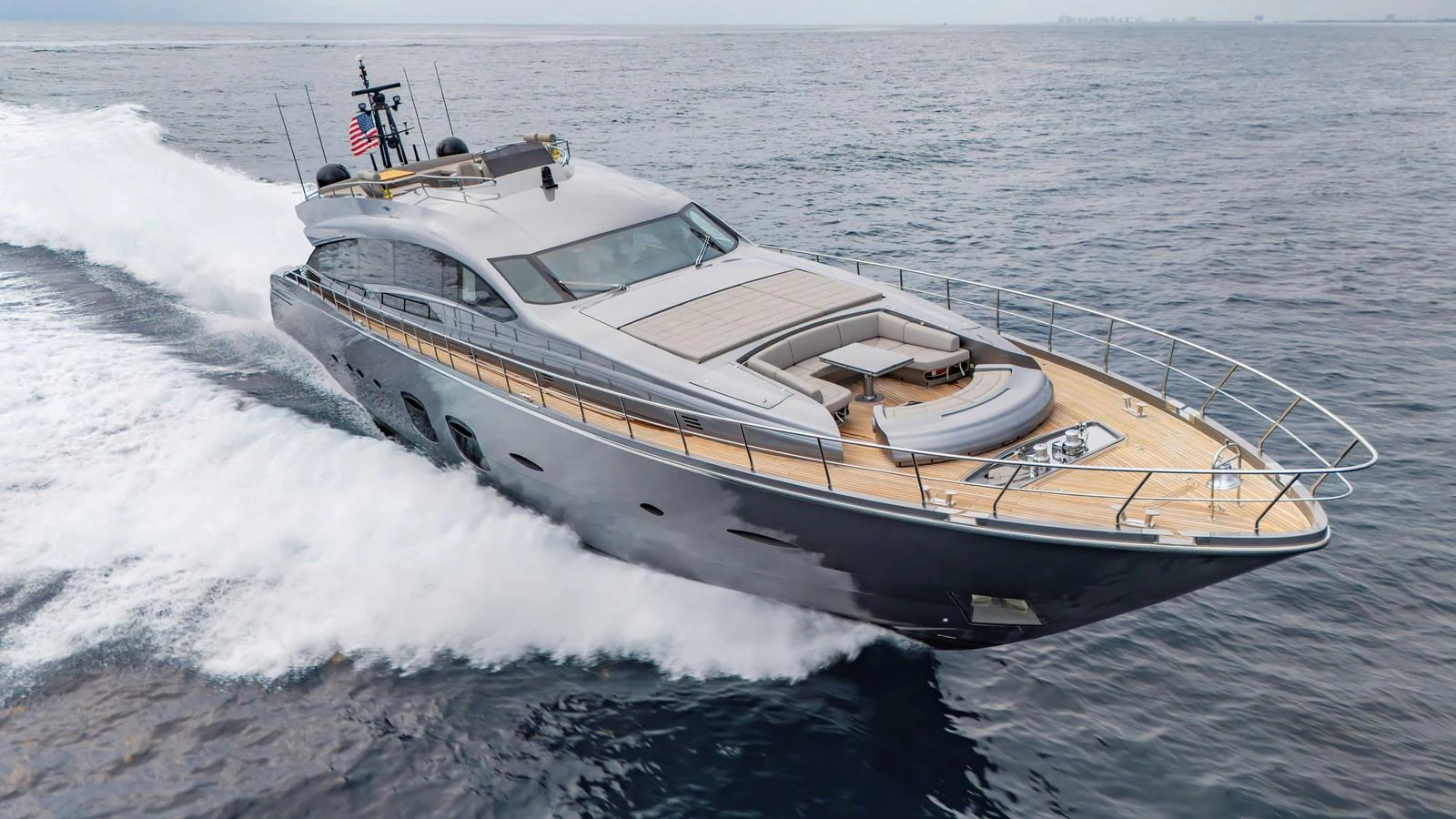 A sleek and modern yacht glides swiftly across the open water, showcasing its luxurious design and powerful performance. aboard ANDIAMO II Yacht for Sale