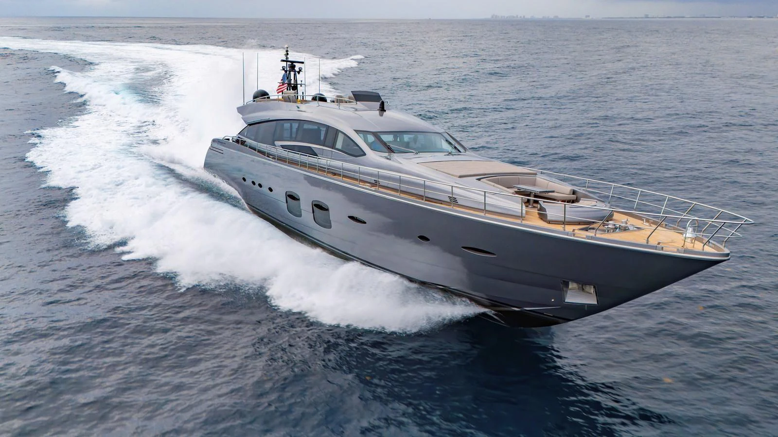 A sleek and modern yacht glides swiftly over the water, showcasing its powerful design and luxurious exterior. aboard ANDIAMO II Yacht for Sale