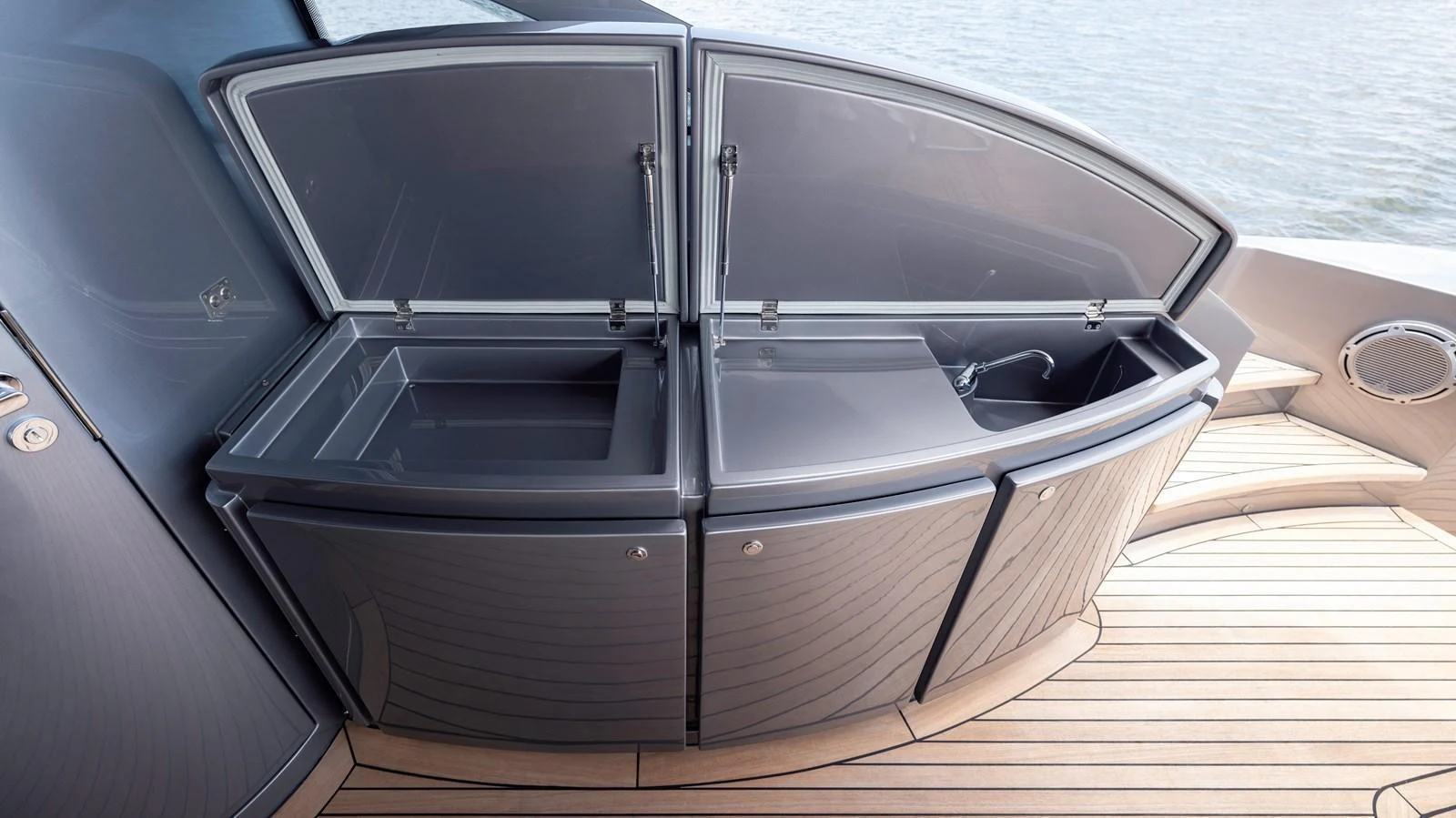 The image showcases a sleek, modern storage area on the yacht's deck, featuring two open compartments with a stylish design. aboard ANDIAMO II Yacht for Sale