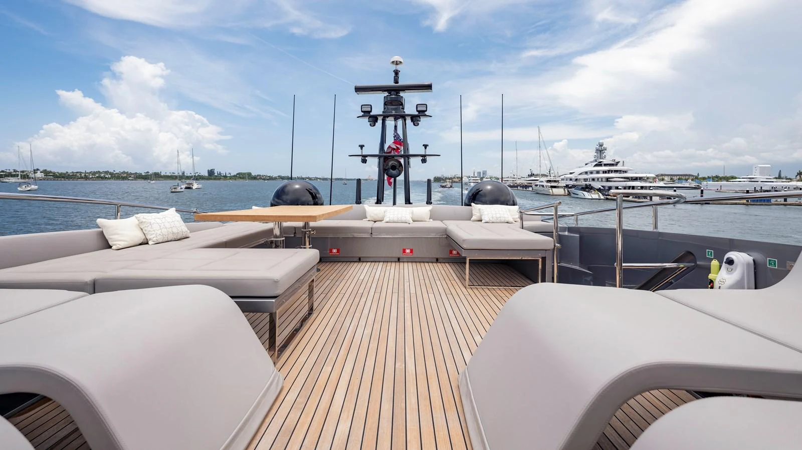 The aft deck offers a spacious and inviting area for relaxation with ample seating and a beautiful view of the marina. aboard ANDIAMO II Yacht for Sale