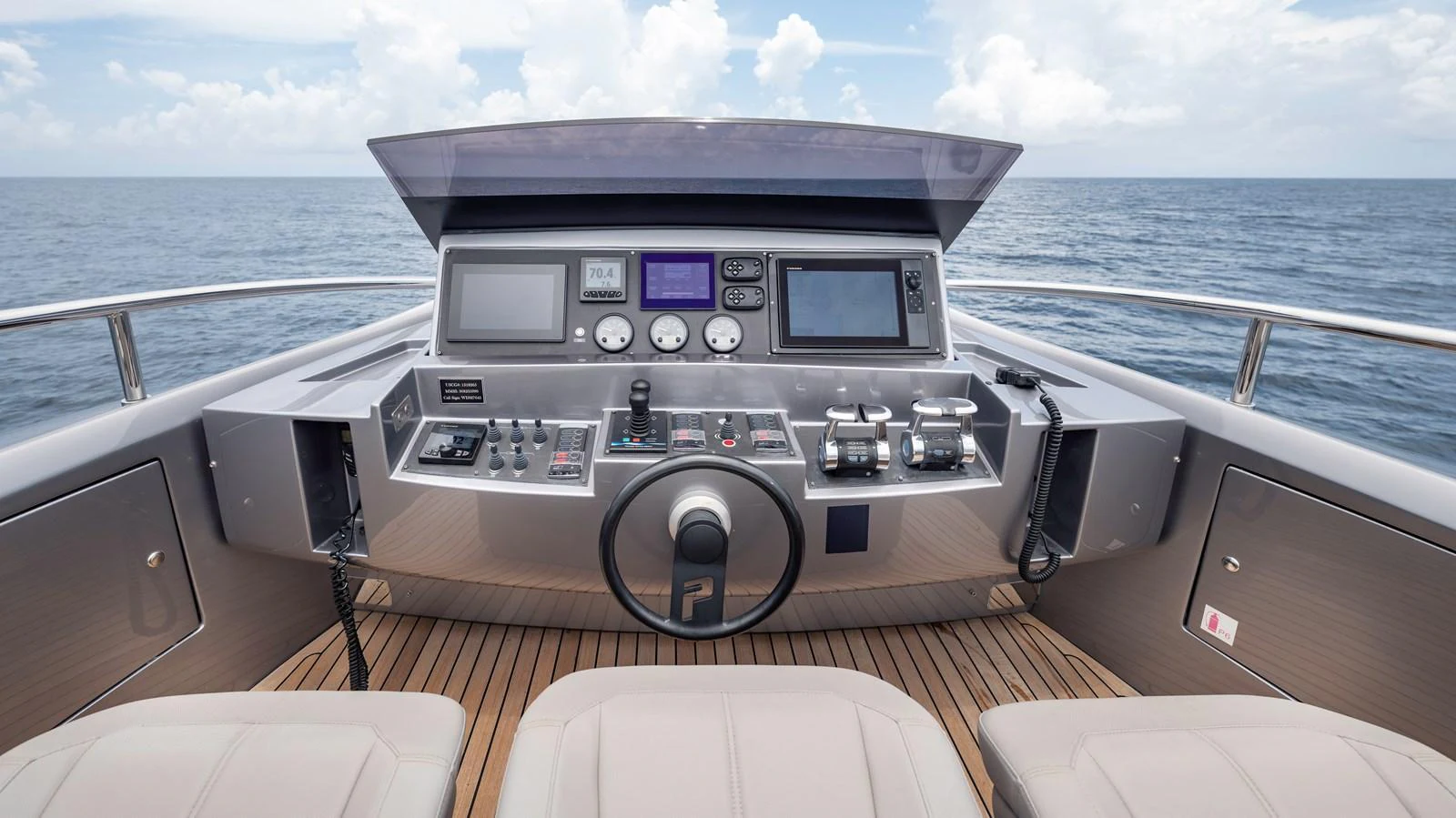 The helm station offers a sleek and modern control area with advanced navigation equipment. aboard ANDIAMO II Yacht for Sale