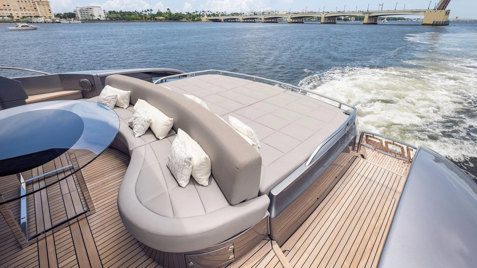 The aft deck features a spacious sunpad with plush cushions, perfect for lounging while cruising. aboard ANDIAMO II Yacht for Sale