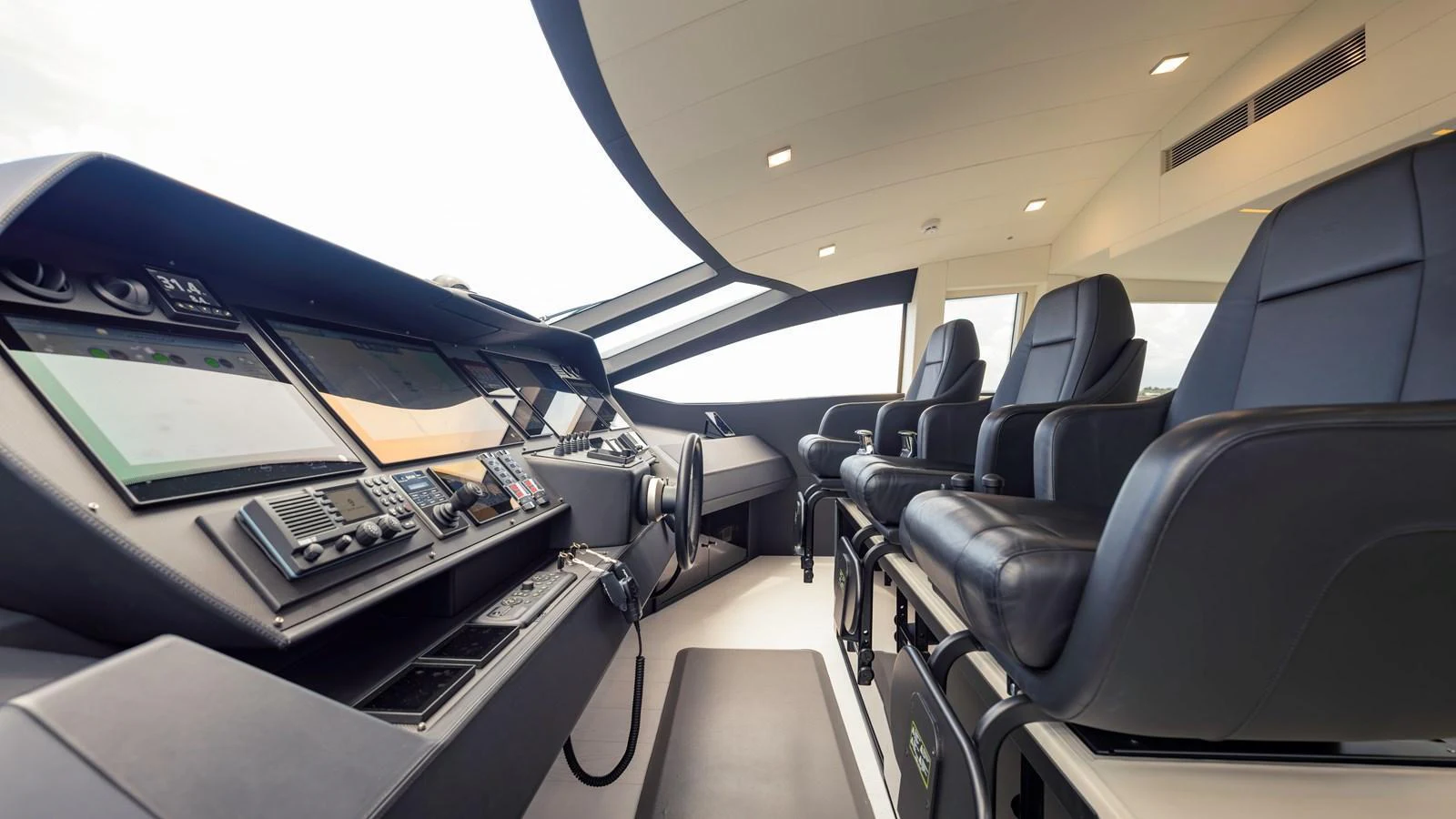 The helm station features advanced navigation equipment and luxurious seating for optimal comfort and control. aboard ANDIAMO II Yacht for Sale