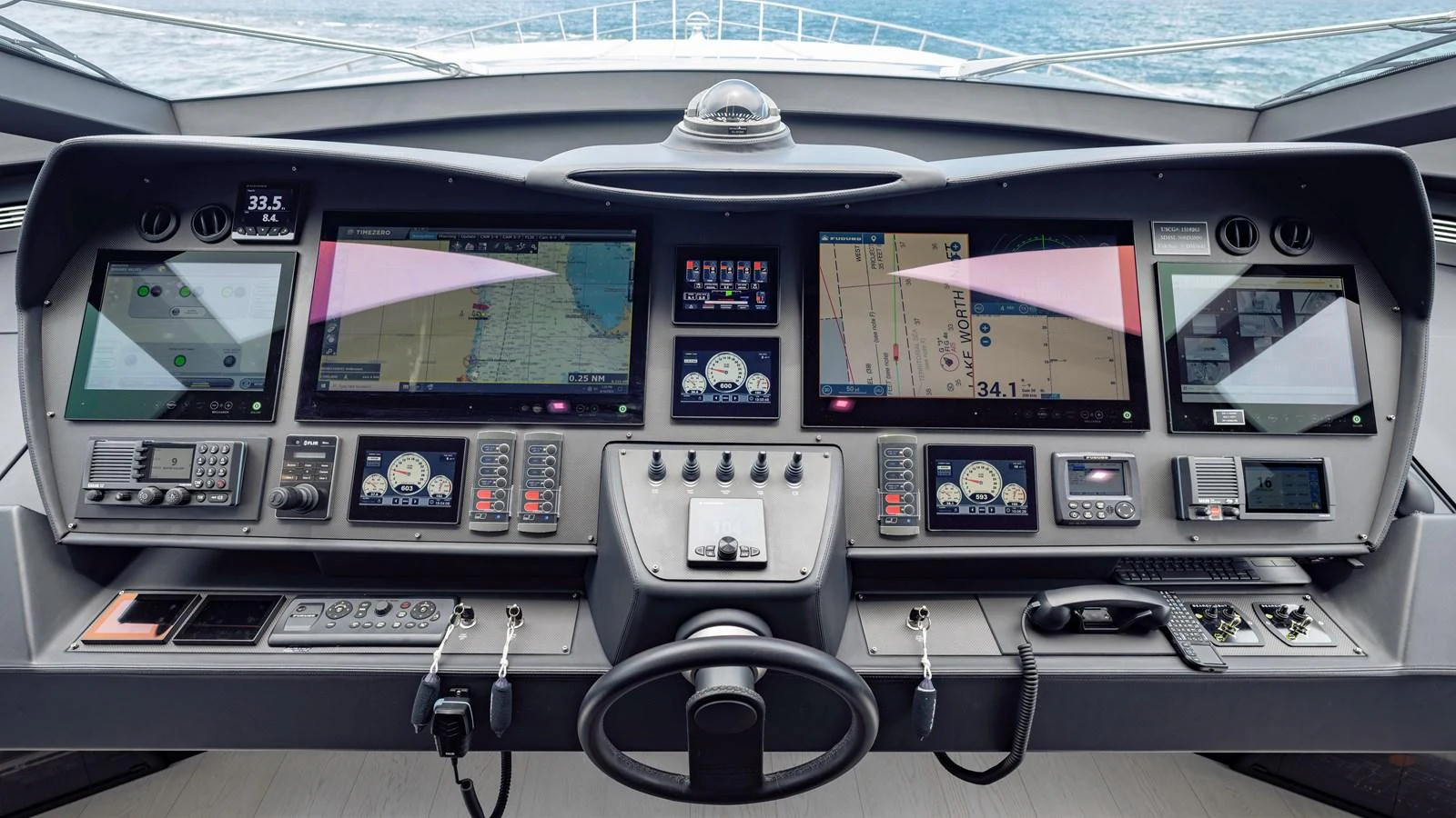 The helm station features advanced navigation and control systems for a seamless sailing experience. aboard ANDIAMO II Yacht for Sale