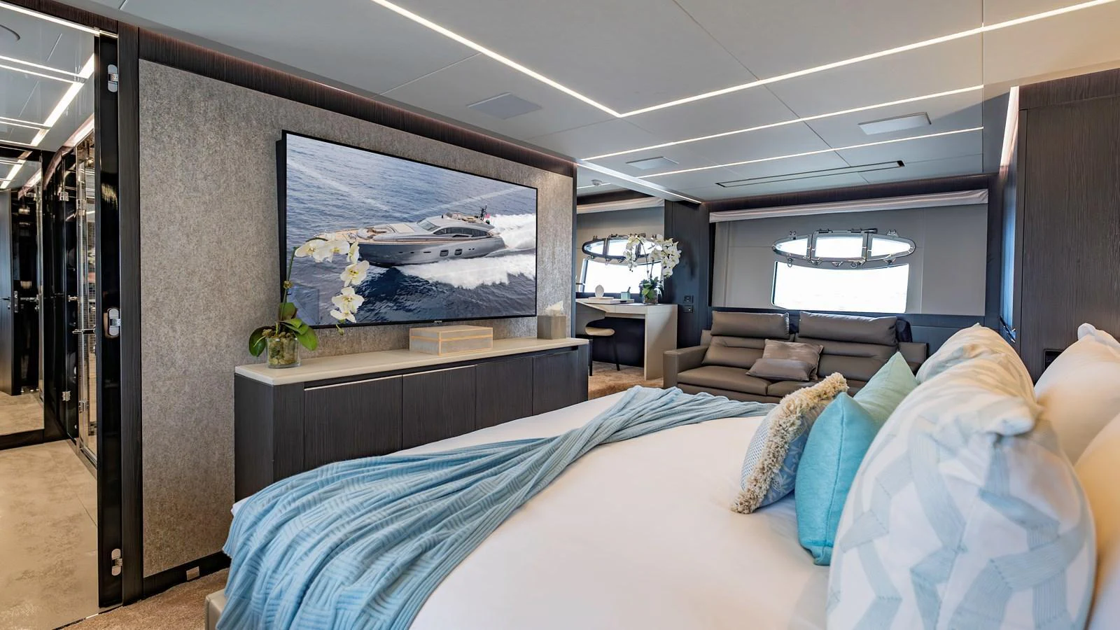 The master stateroom features a luxurious bed, modern decor, and ample natural light. aboard ANDIAMO II Yacht for Sale