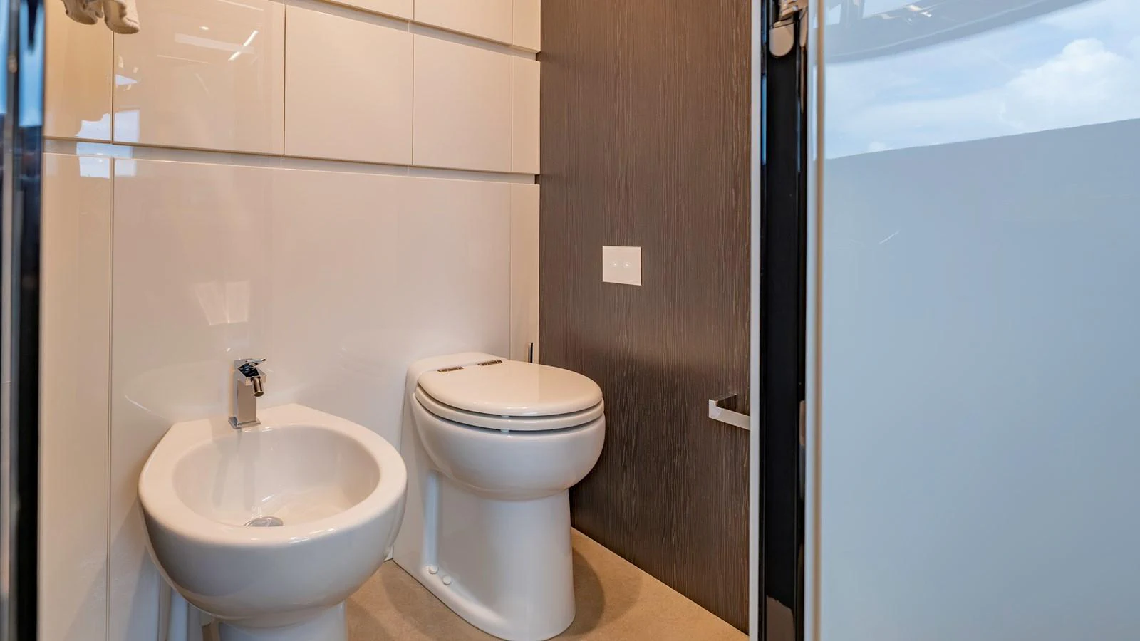 The yacht's bathroom features modern fixtures and a sleek design. aboard ANDIAMO II Yacht for Sale