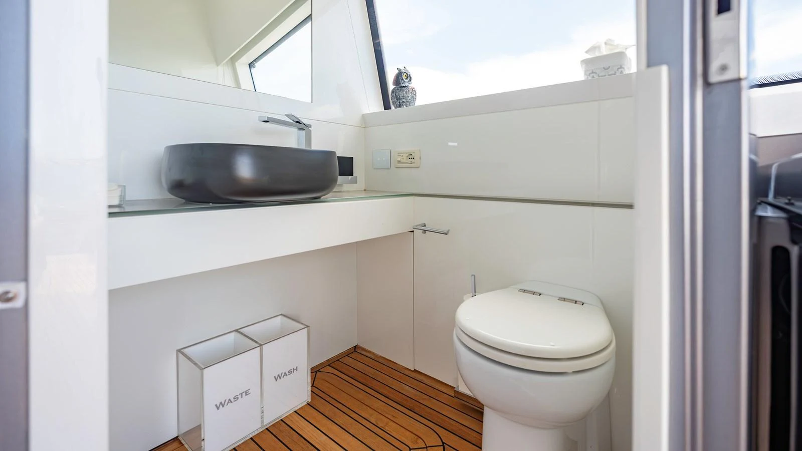 The yacht's bathroom features modern fixtures and a clean, minimalist design. aboard ANDIAMO II Yacht for Sale