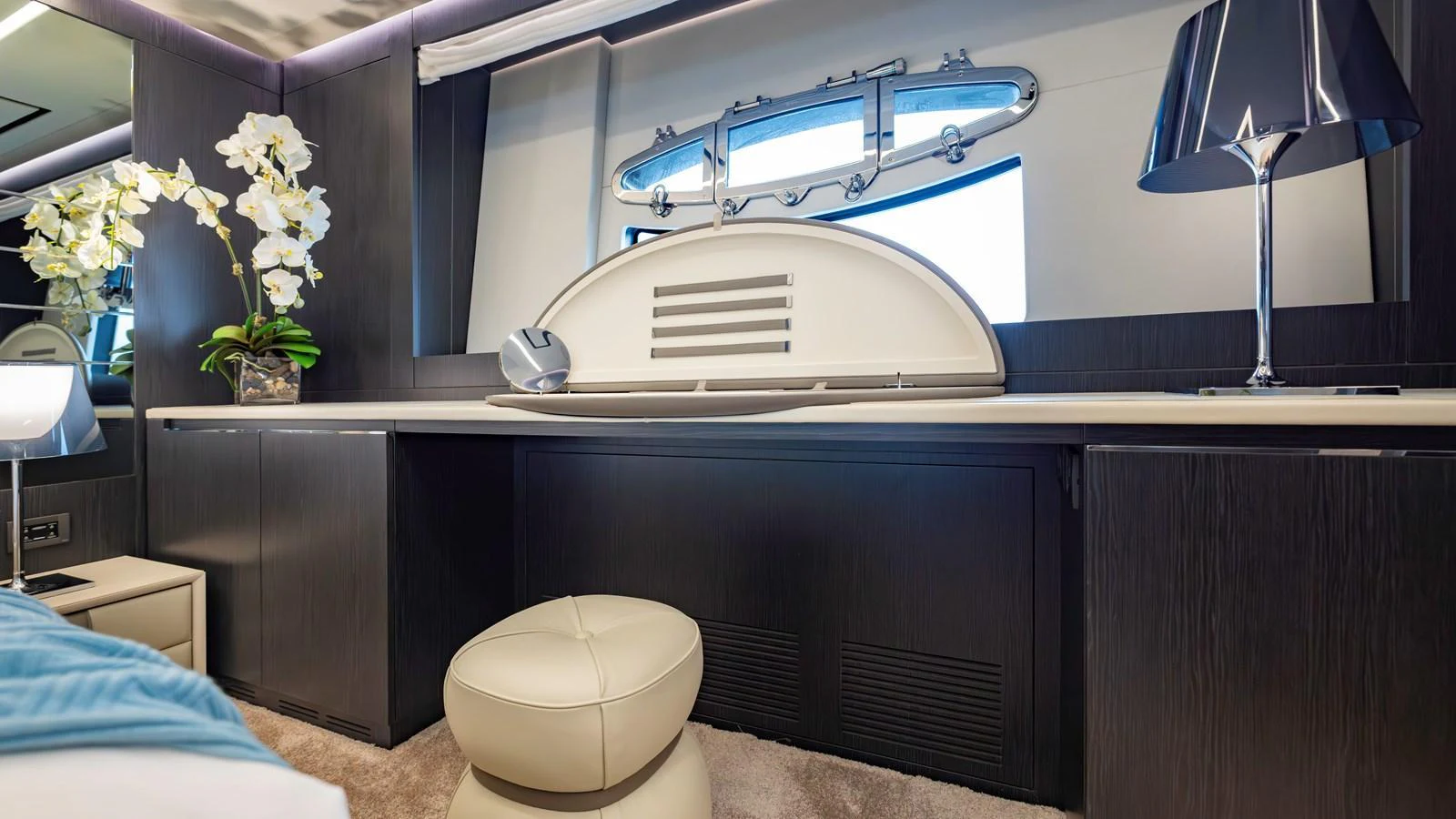 A luxurious interior space featuring a sleek desk area with modern decor and elegant lighting. aboard ANDIAMO II Yacht for Sale