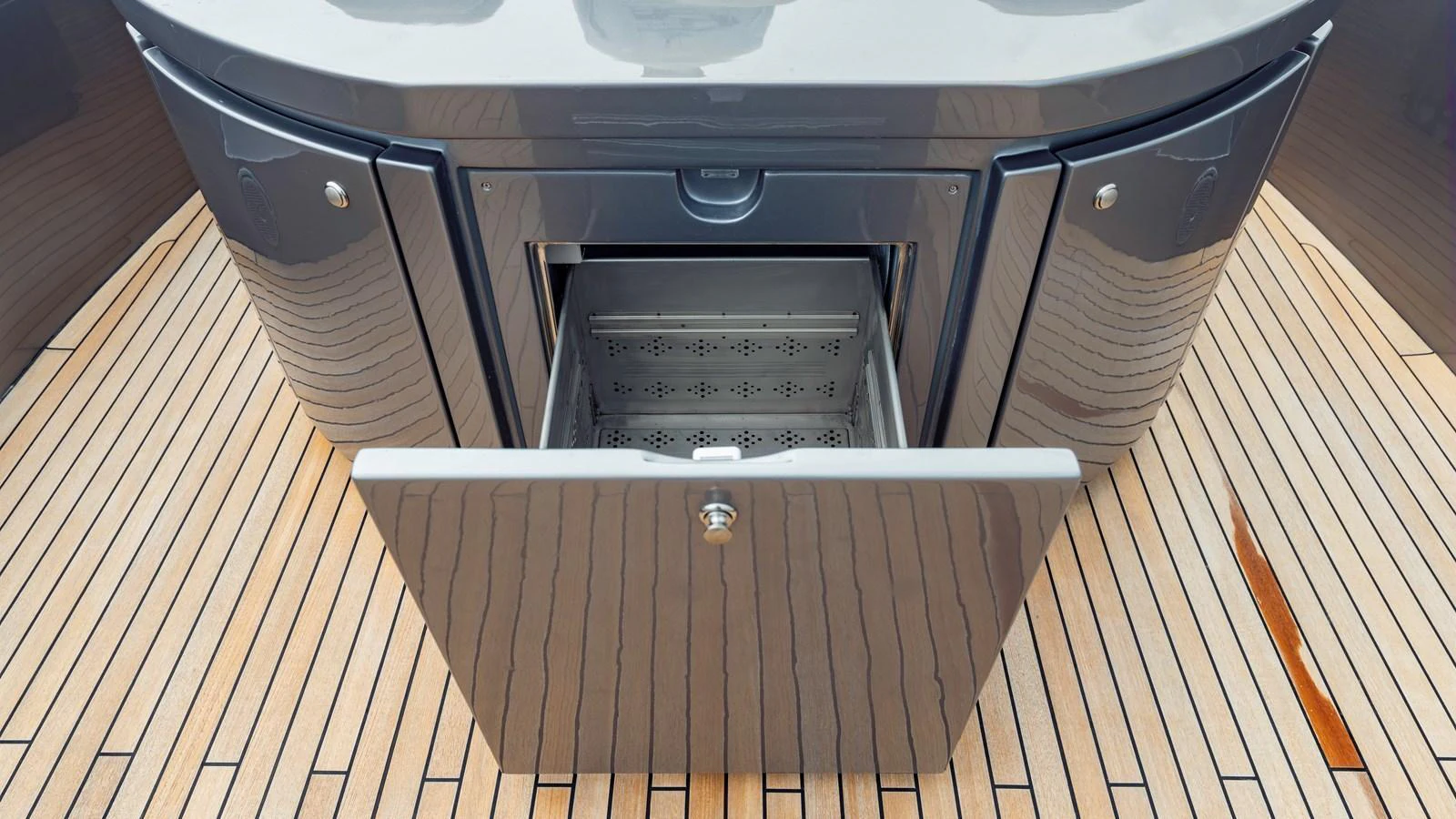 A sleek, modern storage compartment on the yacht's deck, showcasing high-quality materials and craftsmanship. aboard ANDIAMO II Yacht for Sale