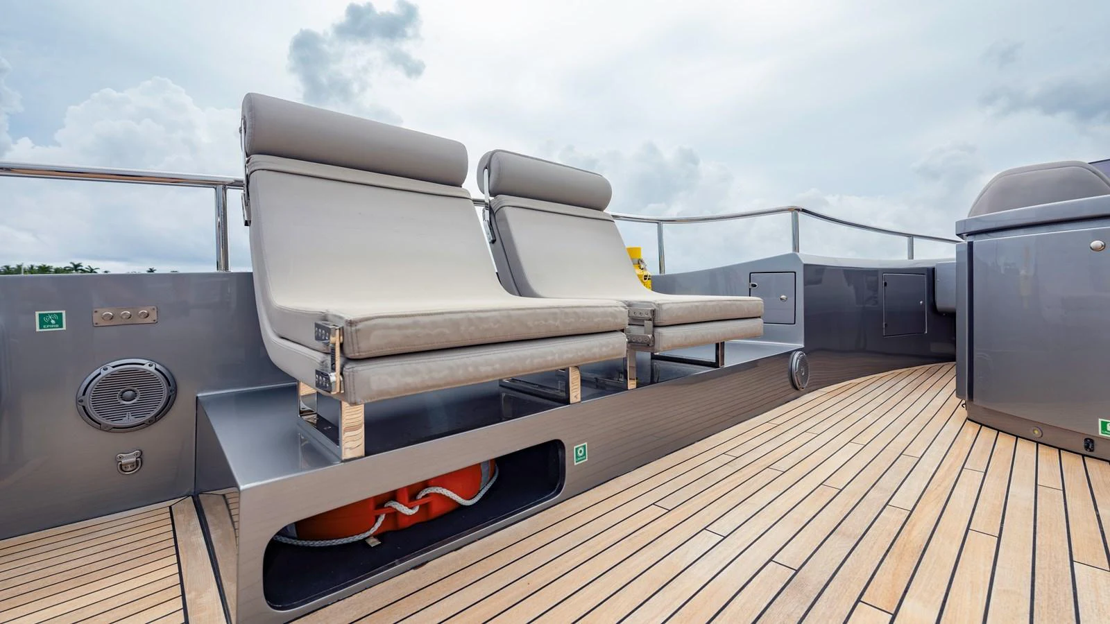 The sundeck features comfortable lounge chairs and a sleek, modern design. aboard ANDIAMO II Yacht for Sale